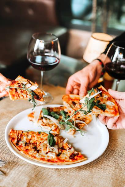 istock Young woman eating Delicious pizza 1459548794