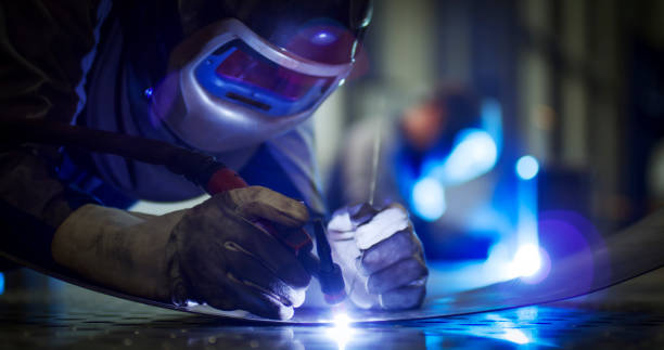 istock Welder working in factory 1459548945