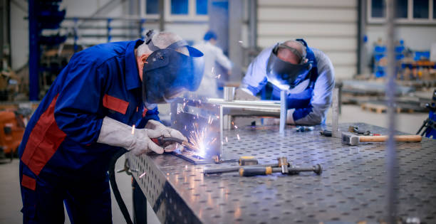 istock Welders working in factory 1459548947