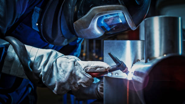 Welder working in factory