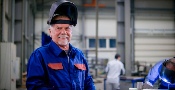 istock Welder standing in factory 1459550745