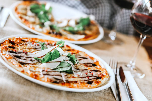 Veal ham pizza with Rocket Leaves or Arugula