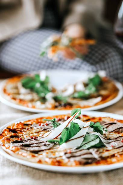 istock Veal ham pizza with Rocket Leaves or Arugula 1459551756