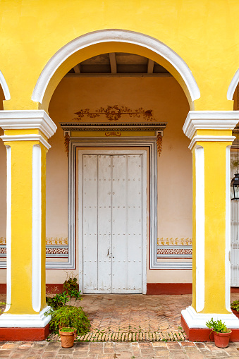 Exterior wih arcade in colonial style in the center of Trinidad, Cuba, Caribbean