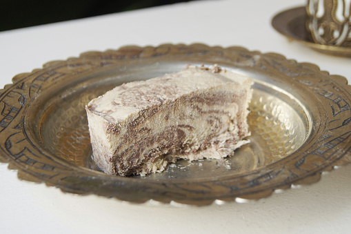 Halva. Most halvas are dense confections made from a variety of pastes and then sweetened with sugar or honey.