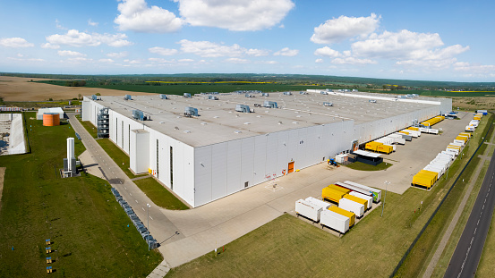 Large distribution warehouse building outside the city in West Pomeranian Voivodeship near Szczecin, Poland