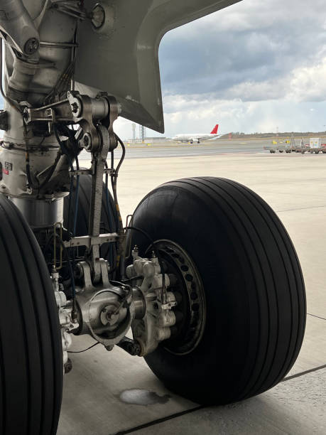 istock airplane landing wheel is in apron vertical still 1459554689
