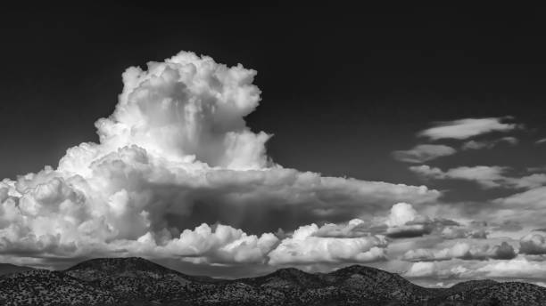 Grayscale of clouds over Sangre de Cristo Mountains in Santa Fe, New Mexico, USA A grayscale of clouds over Sangre de Cristo Mountains in Santa Fe, New Mexico, USA santa fe new mexico mountains stock pictures, royalty-free photos & images