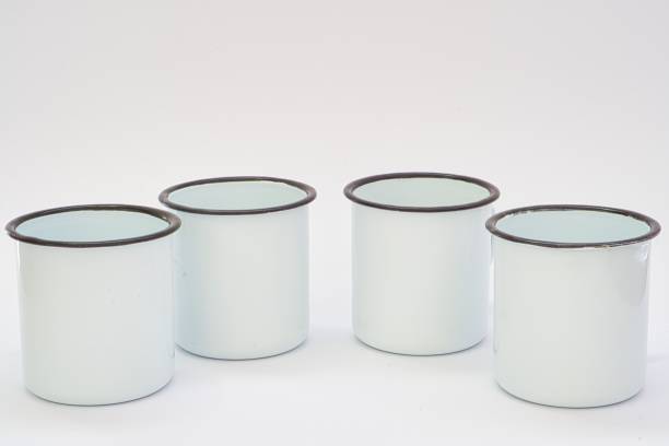 istock Closeup of enameled cups isolated on a white background 1459558188