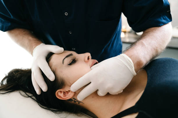 istock Physiotherapist practicing chiropractic techniques on a young adult woman patient 1459558619