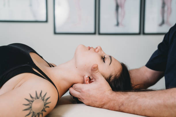 istock Physiotherapist practicing chiropractic techniques on a young adult woman patient 1459558628