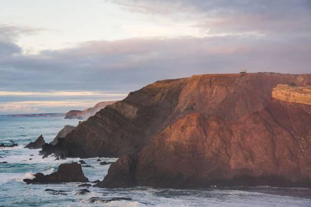 istock Rocky mountain on the sea under cloudy sky 1459558963