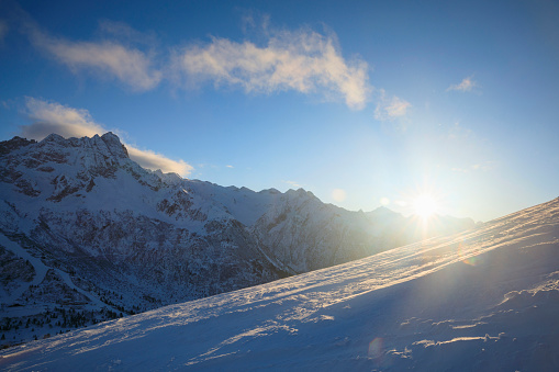 Panoramic High mountain winter landscape  Powder snow at the top. Italian Alps  Dolomite ski area. Ski resort PASSO TONALE. Italy, Europe.