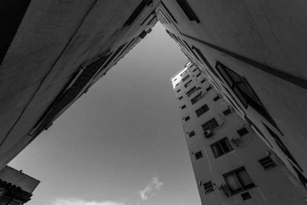 istock Low angle grayscale shot of buildings 1459561451
