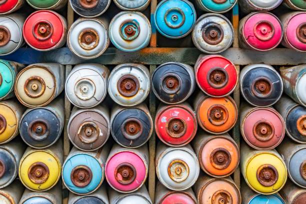 istock Top view of colorful used spray paint cans 1459564742