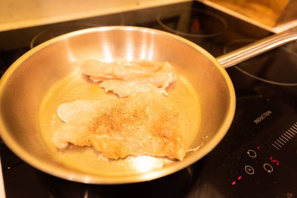 istock Closeup shot of chicken being cooked 1459565107