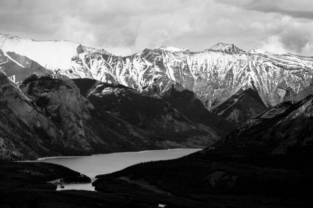 istock Grayscale aerial view of snowy mountains 1459565865