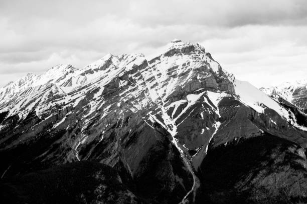 istock Mesmerizing grayscale of a snow-covered mountain peak 1459565871