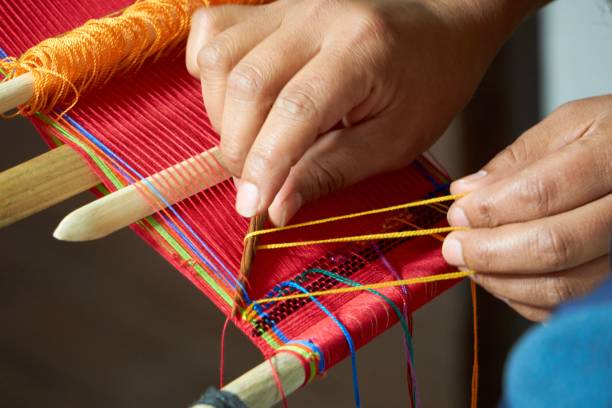istock Tourist learning back strap weaving in Guatemala 1459566439