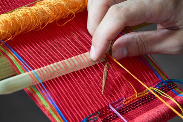 istock Tourist learning back strap weaving in Guatemala 1459566442