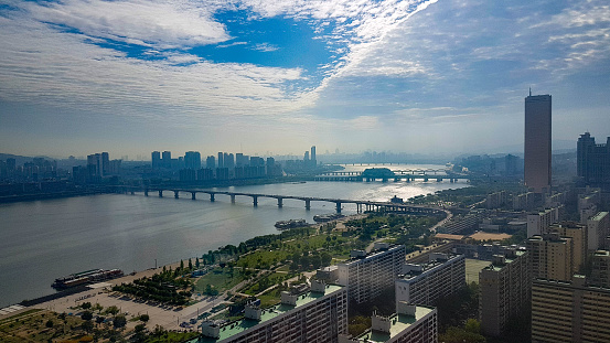 The beautiful city of Seoul in Korea with the River Hangang in the background and cloudy blue sky above