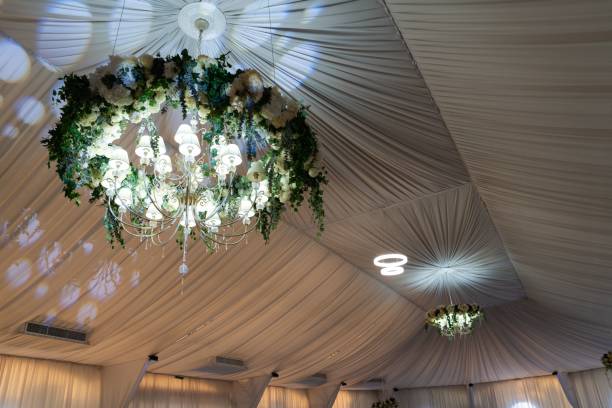 istock Chandeliers in the wedding hall decorated with flowers. 1459568231