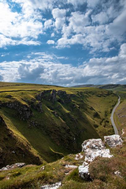 istock Vertical view of the green valley under the blue sky with clouds 1459569835
