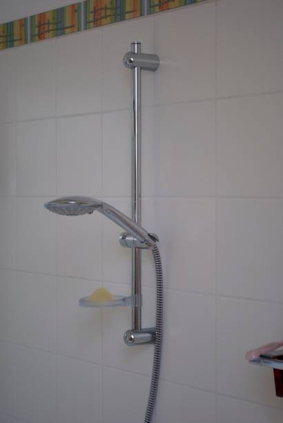 istock Vertical closeup of a wall-mounted shower column for the bathroom 1459570036