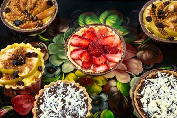 istock Fruit and chocolate pies on a floral patterned background 1459571847