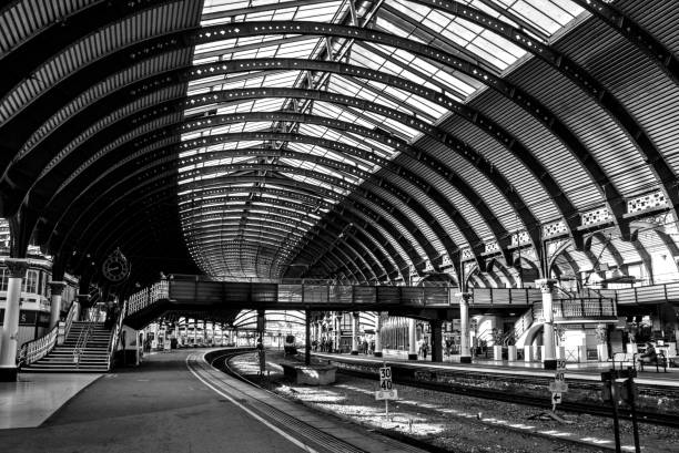 istock Grayscale inside York transit station in England with a railroad and arched roof 1459572249