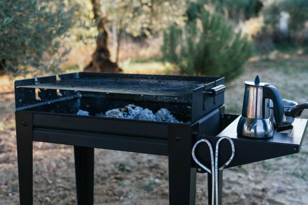 istock Closeup of a barbecue oven with a kettle on a backyard 1459573111