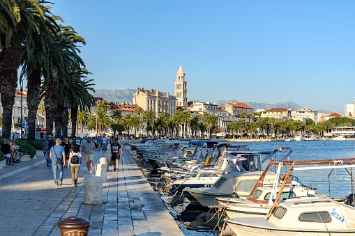 Split, Croatia – June 05, 2021: The tourists on seafront promenade in Split, Croatia