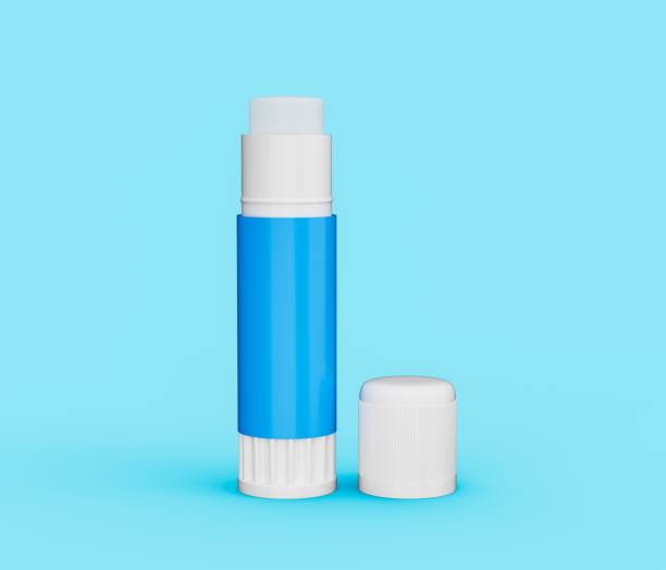istock Open paper glue stick with Cap on a blue background 1459573137