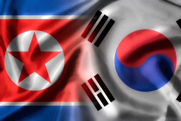 Waving of North and South Korea for politic and military war conflict from both country.