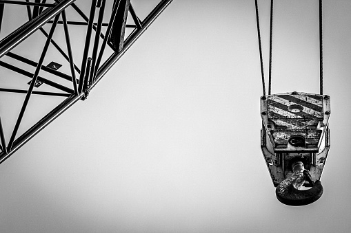 A grayscale shot of the fence crane