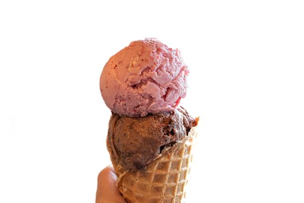 istock Strawberry and chocolate ice cream in a waffle cone isolated on a white background 1459573577