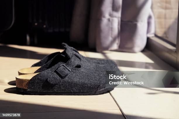 Black Clogs With A Clasp On The Floor Under The Rays Of The Sun Stock ...