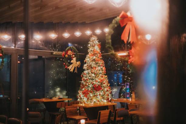 istock Colorful Christmas tree in a beautifully decorated empty cafe 1459574772