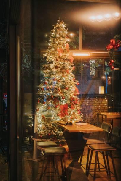 istock Colorful Christmas tree in a beautifully decorated empty cafe 1459574819