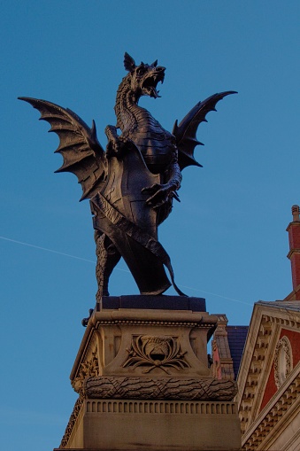 A vertical shot of a dragon statue in London