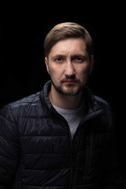 istock Portrait of a man on a black background. 1459578868