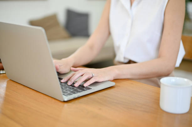 istock cropped image, Beautiful businesswoman working from home, using laptop 1459578987