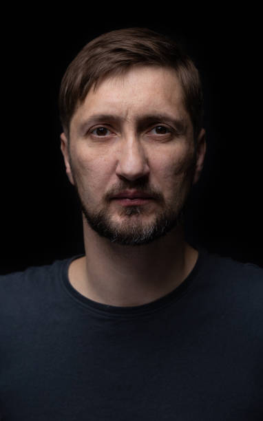 istock Portrait of a man on a black background. 1459579012