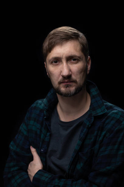 istock Portrait of a man on a black background. 1459579062