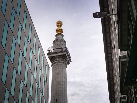 A close-up shot of the Great Fire column monument in London, UK
