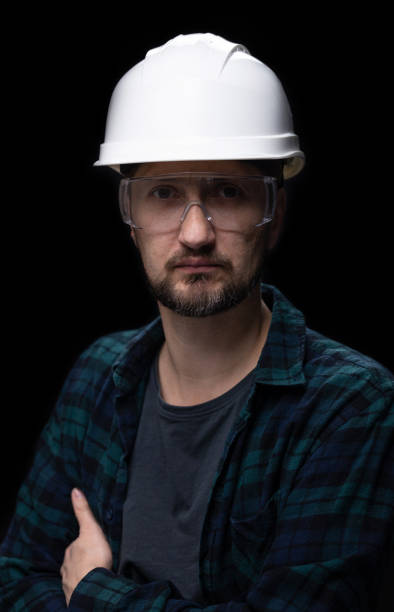 istock Portrait of a worker on a black background. 1459579085