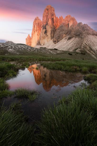 istock Drei Zinnen in the Dolomites at sunset with a reflection 1459579685