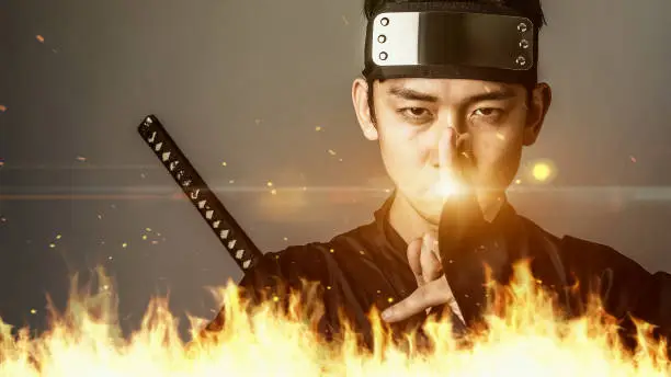 Japanese ninja using magic of fire. Samurai.