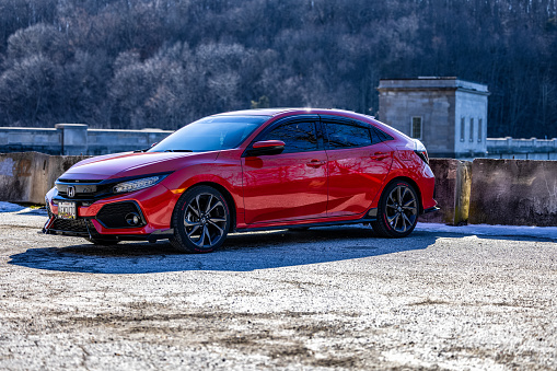 Sykesville, United States – January 25, 2022: Luxurious red Honda Civic at Pretty boy Reservoir in MD