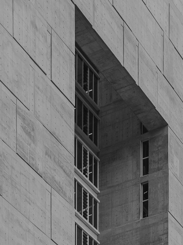 San Jose, Costa Rica – April 10, 2022: A black and white of a building and windows in the capital of Costa Rica San Jose.